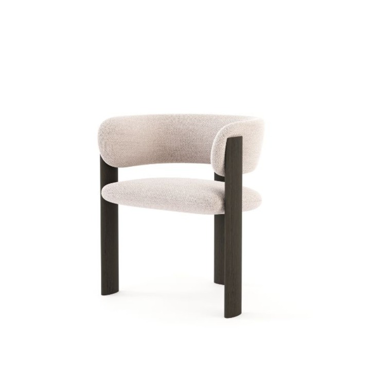The Dolomites Chair is shown as a sculptural upholstered chair in a light neutral fabric, featuring a curved seat and backrest supported by two tall vertical wooden legs that rise above the seat, creating a striking contrast between soft upholstery and strong linear wood elements.