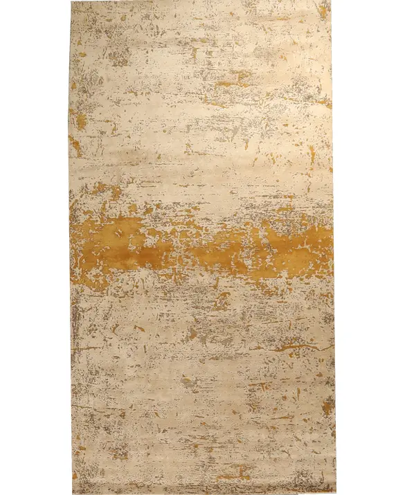 Foto of a rug with an abstract design in gold and sand tones