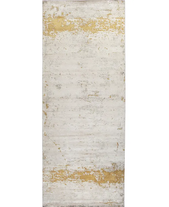 Foto of a rug with an abstract design in gold and sand tones