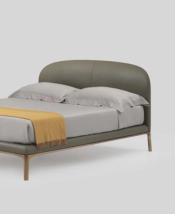 upholstered bed with metal legs designed by Philippe Tabet per Pianca