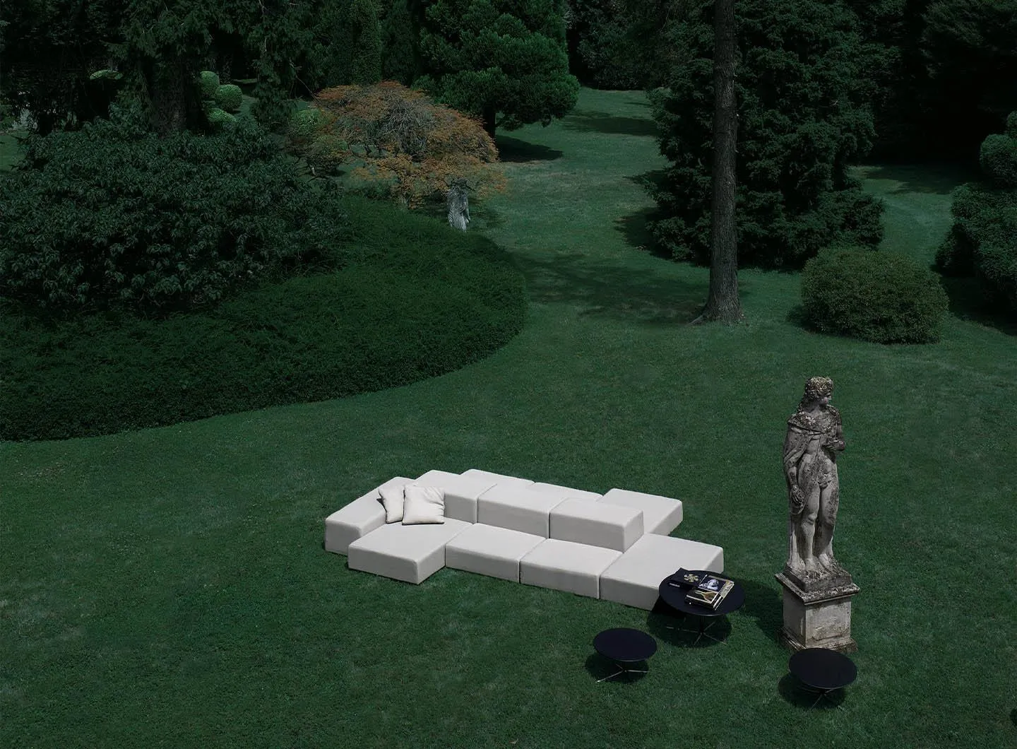 outdoor couch, grass, statue