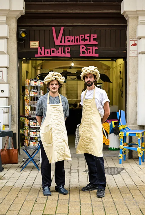 Diego Faivre and Pierre Castignola dressed as noodles at Vienna Design Week 2022