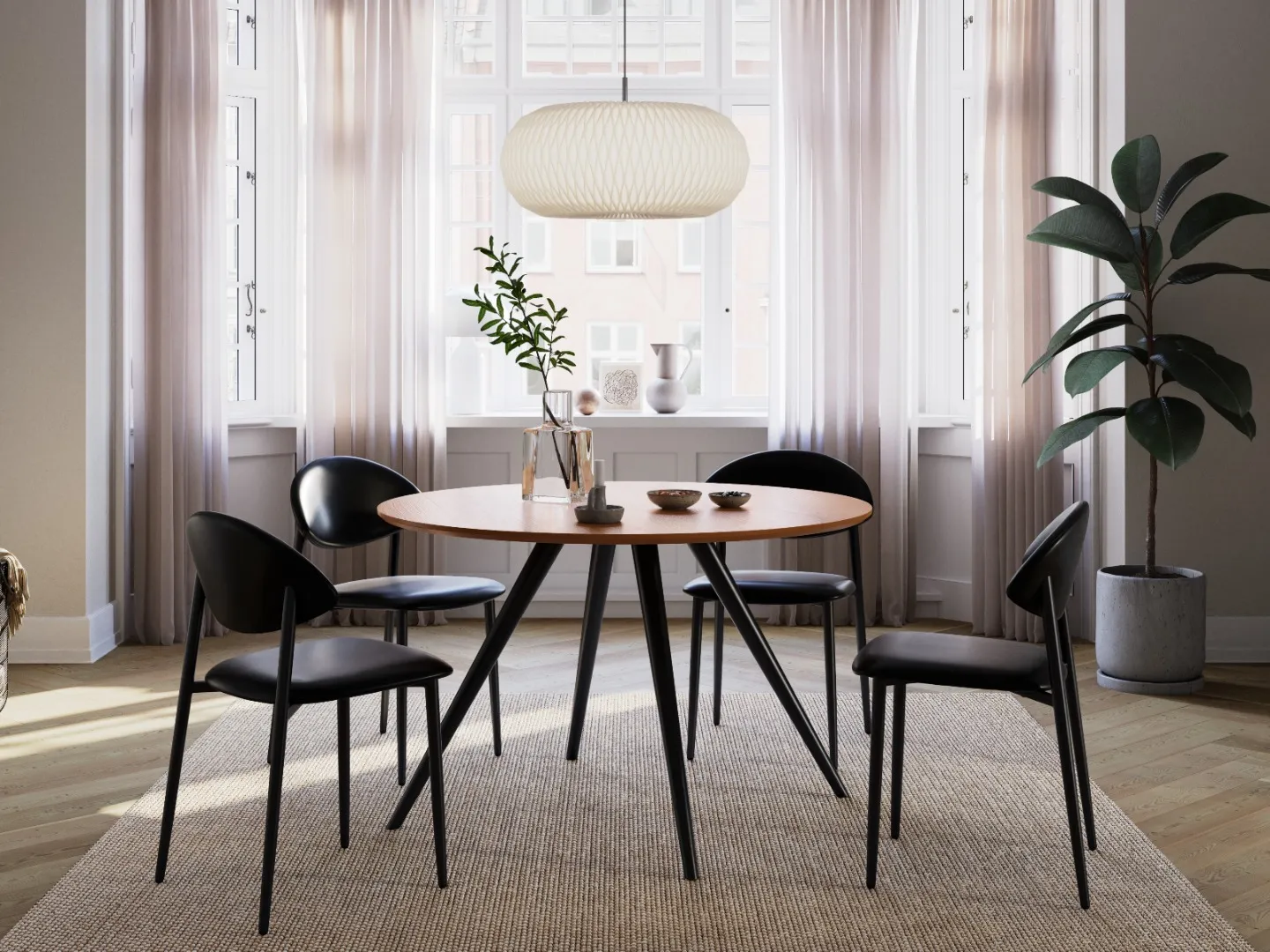 DAN-FORM's TUSH chairs in vintage black artificial leather around the round ECLIPSE table