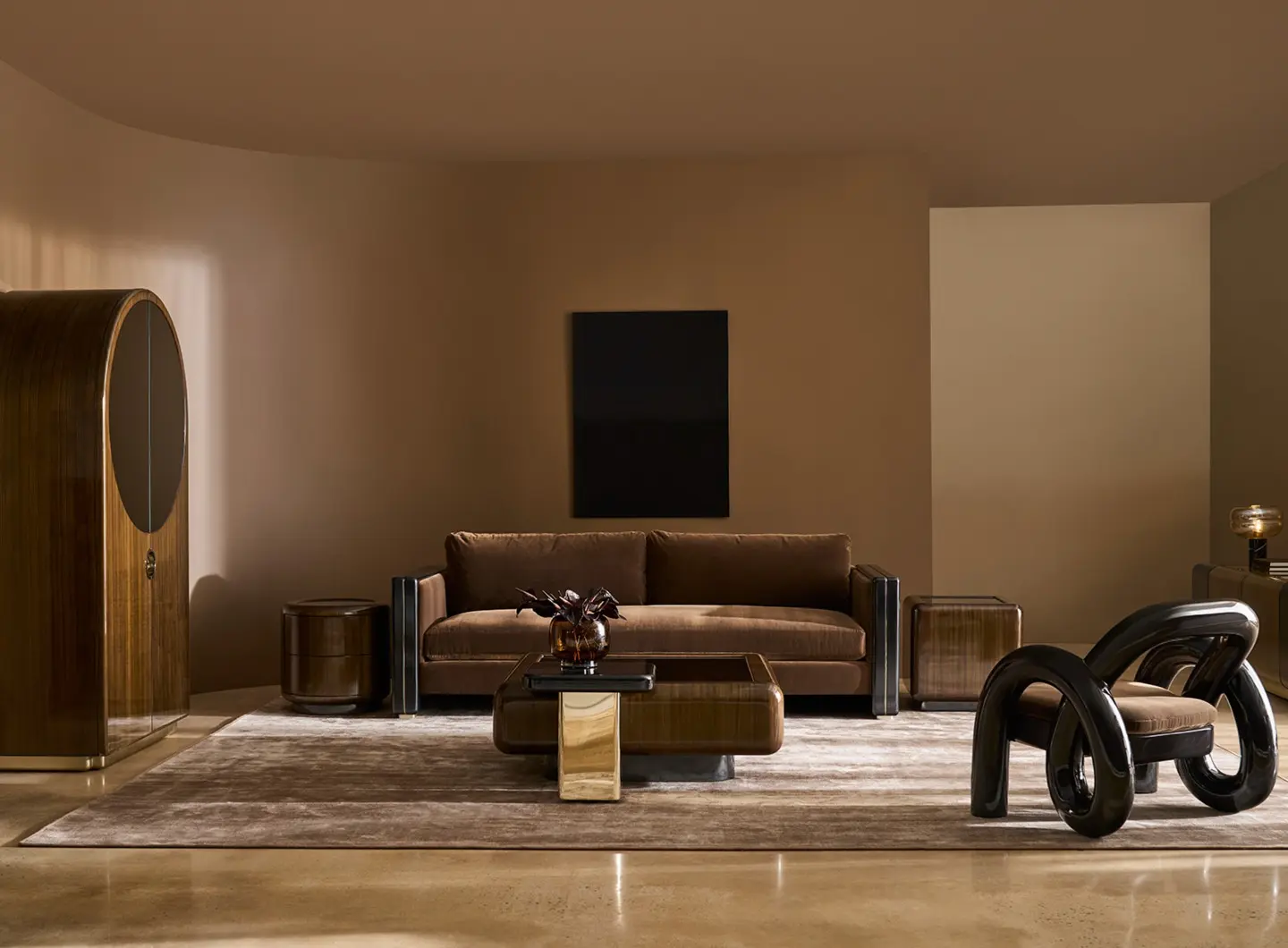 Caracole bedroom with sculptural headboard, bold accent chair, and modern nightstands in a rich, contemporary palette.Caracole dining space with minimalist table and plush, curved chairs, set against architectural columns.Caracole living room with statement seating, polished wood finishes, and sleek, modern decor.