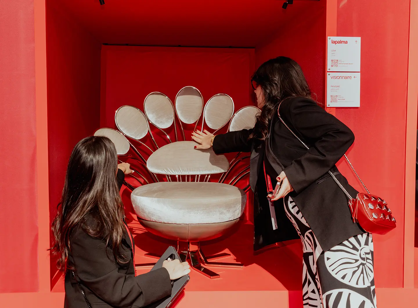 Red in progress, installation Giò Forma, with visitors viewing and touching the products