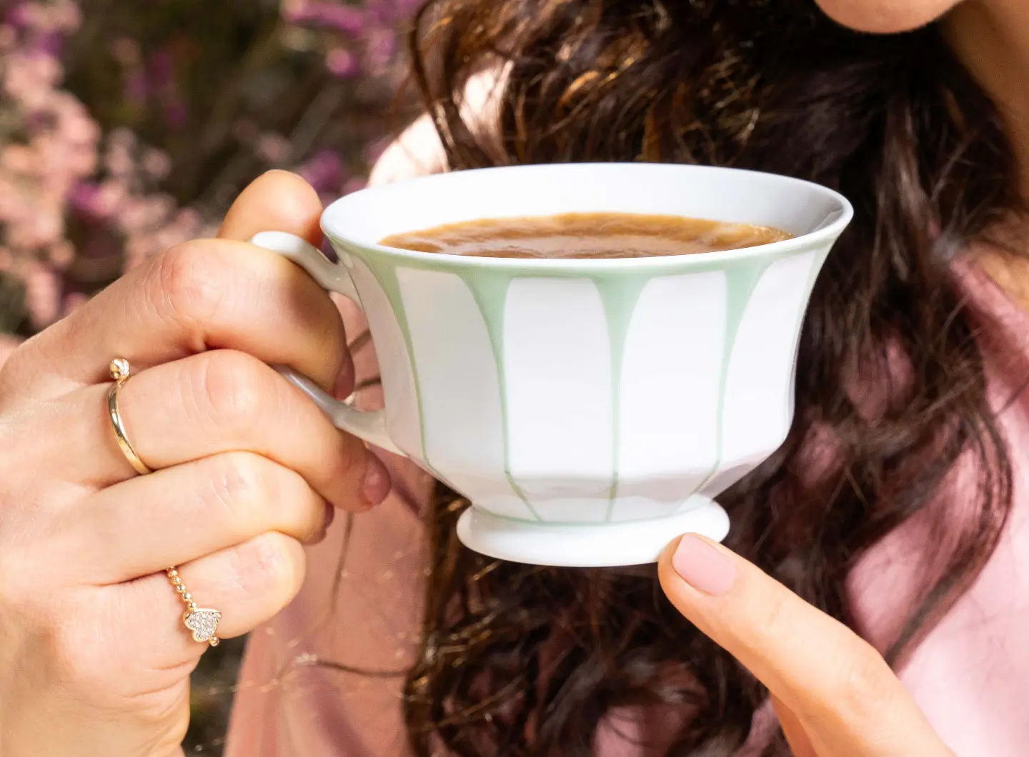 Woman holding a coffee cup in her hands