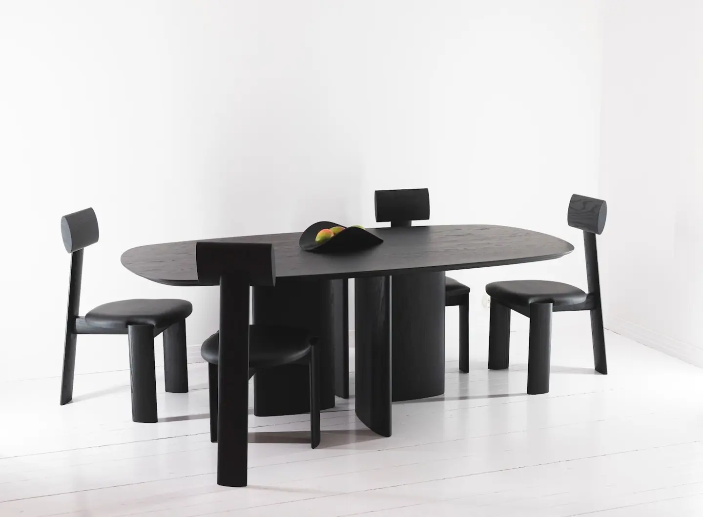 Dining table and chairs in blackened ash