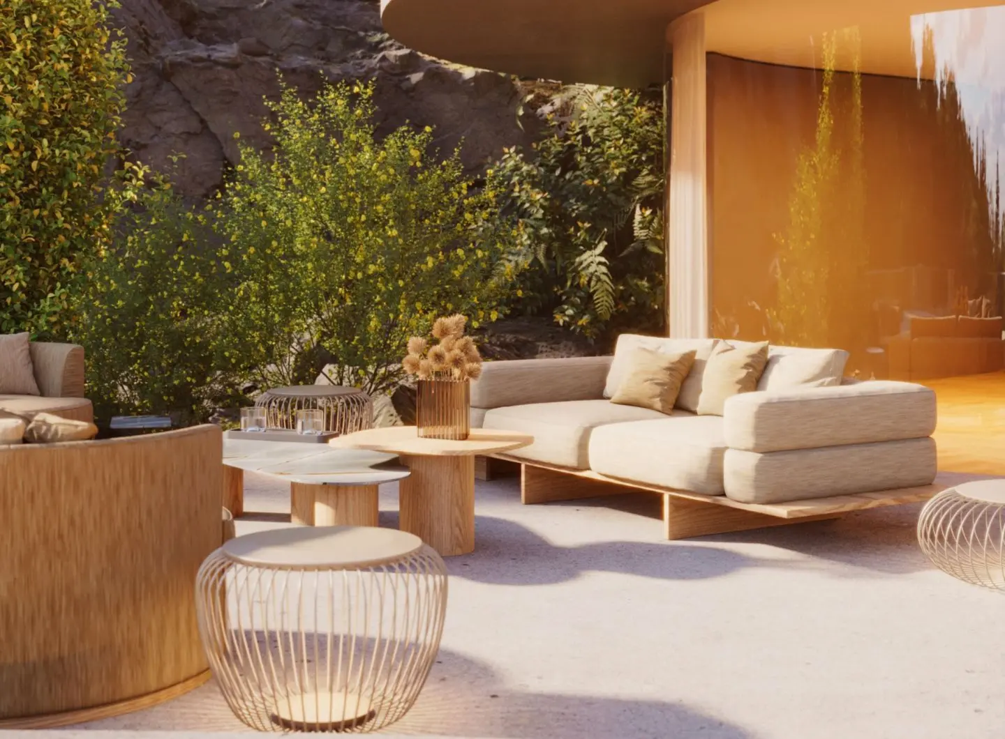 A serene outdoor lounge featuring the Ripa Sofa with soft neutral cushions paired with the organic Natur Coffee Table, set against lush greenery and stone textures. A calming space that blends modern furniture with nature.