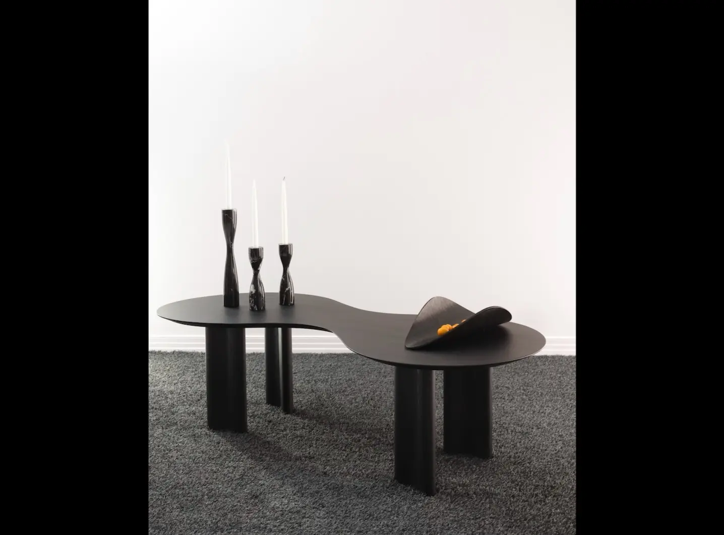 Sofa table in blackened ash, marble candleholders and Snail dish