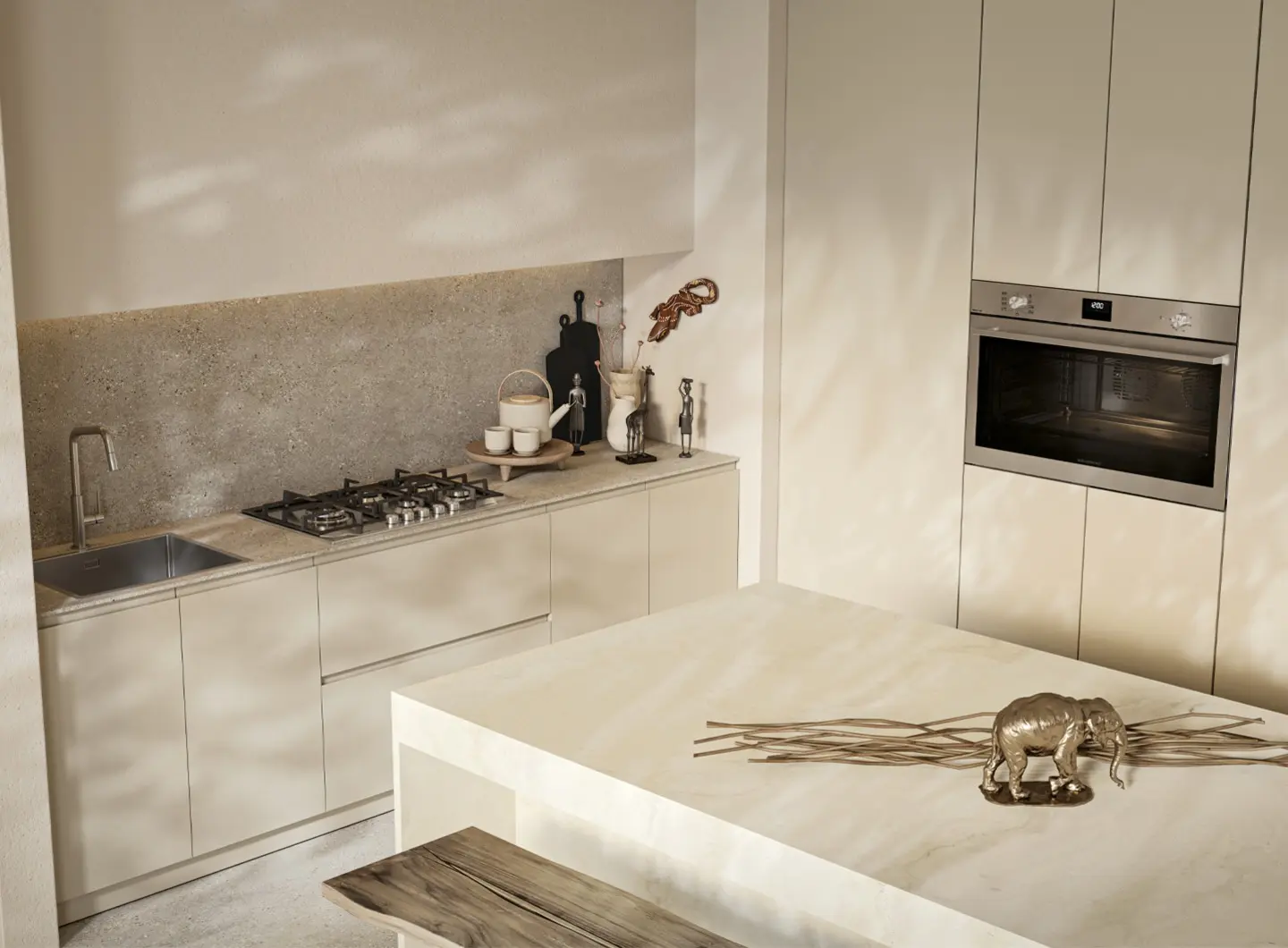 View of a minimalist kitchen in warm, neutral tones. A 90 cm built-in stainless steel oven with an XL cavity is integrated into a wall column. On the countertop, a slim 4-burner stainless steel gas hob is installed next to a coordinated integrated sink and stainless steel mixer tap.