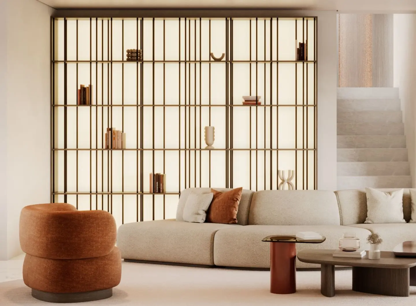 The Buren Bookcase is shown as an illuminated shelving structure with a geometric grid of vertical and horizontal lines, placed behind a light beige sectional sofa with rust‑toned accents, accompanied by a rounded armchair and minimalist coffee tables in a warm, balanced living room.