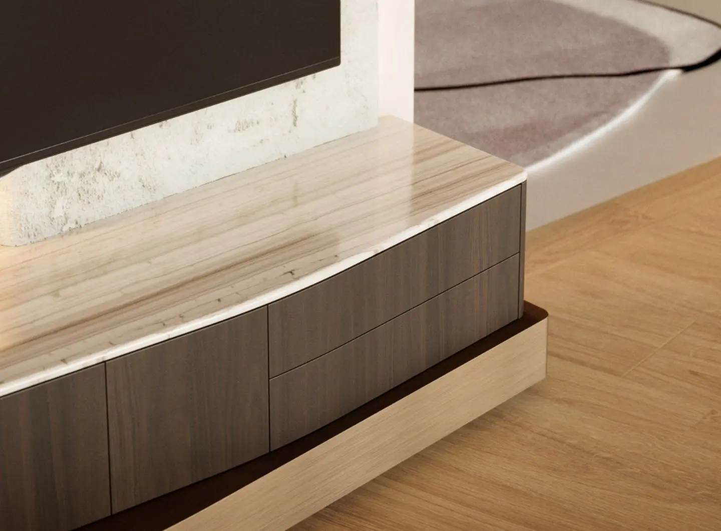 A close view of the Stone TV Cabinet shows its layered structure combining wood, marble, and brass details, with a wooden storage section beneath a polished marble top and subtle brass accents, set against a textured wall in a contemporary interior.