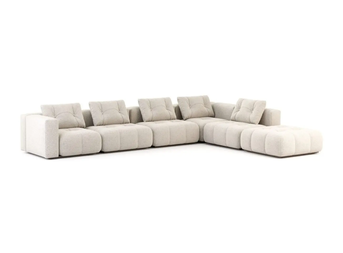 The Antónia Sofa is presented as a large L‑shaped modular sectional in light bouclé with deeply tufted seat and back cushions, arranged with a chaise extension on the right and a low, architectural profile that emphasizes its generous volumes and contemporary presence.
