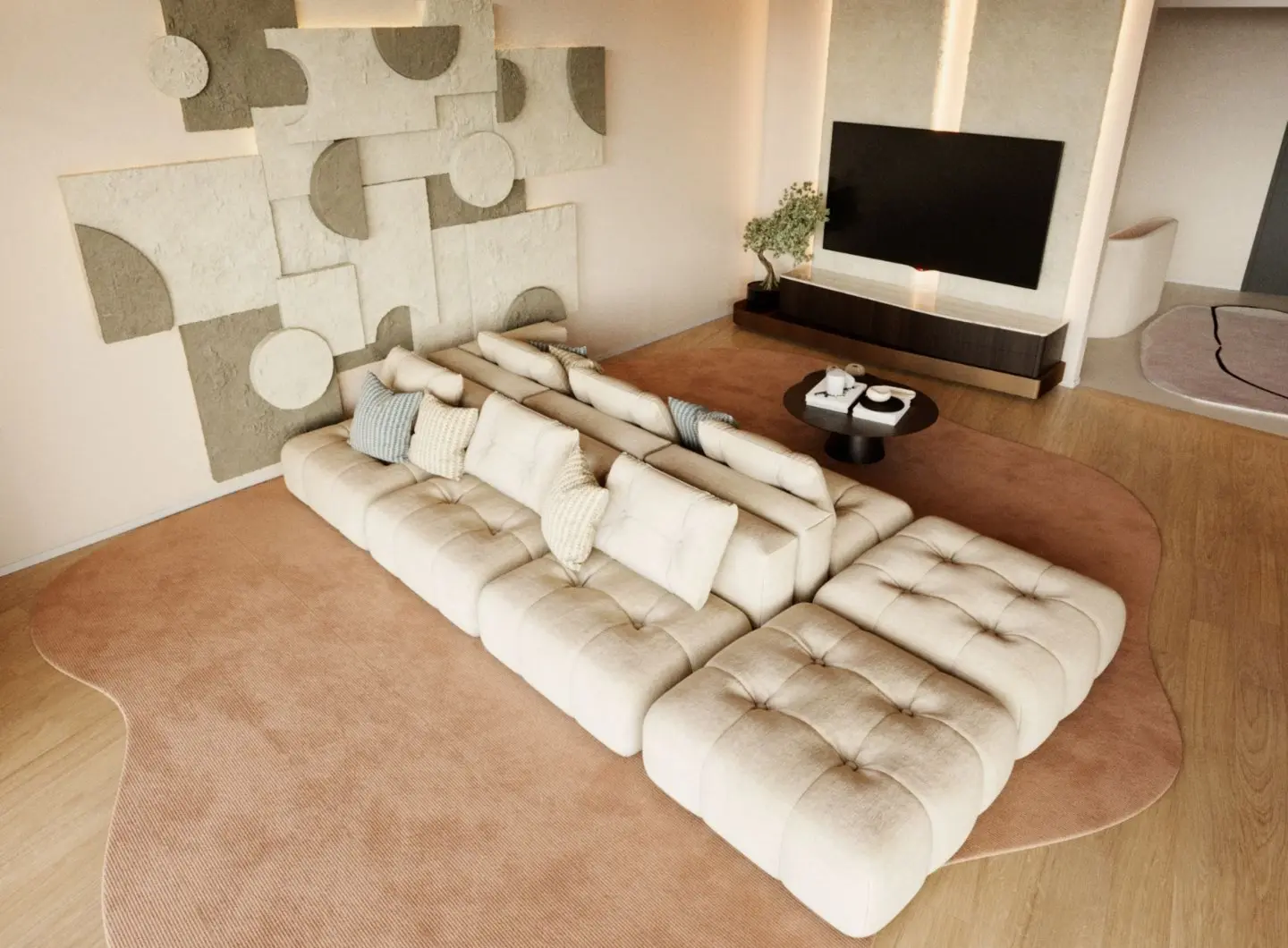 The Antónia Sofa appears as a beige modular sectional with tufted cushions and layered neutral pillows, placed on an irregular light brown rug before a round black coffee table with tea service, framed by a media wall with a mounted television, a dark wood console, and geometric textured art panels that create a serene, contemporary living space.