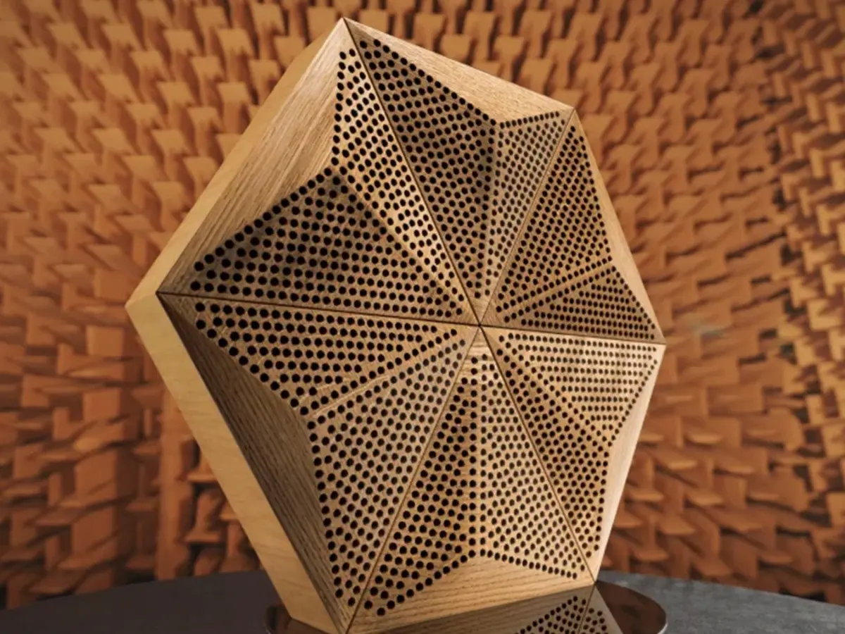 Professional recording studio featuring an industrial concrete wall with an installation of acoustic hexagonal oak wood panels.