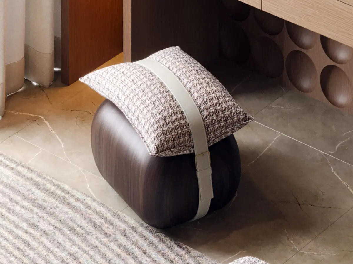 De Berry stool by Muranti with solid rounded wooden base, cushioned seat, and a strap detail connecting the base and cushion, combining comfort and refined contemporary design.