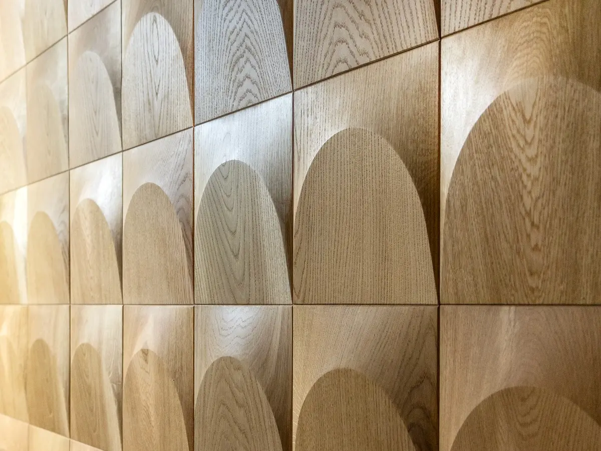 Wall accent panel made of wood adding structure and depth to the living space.