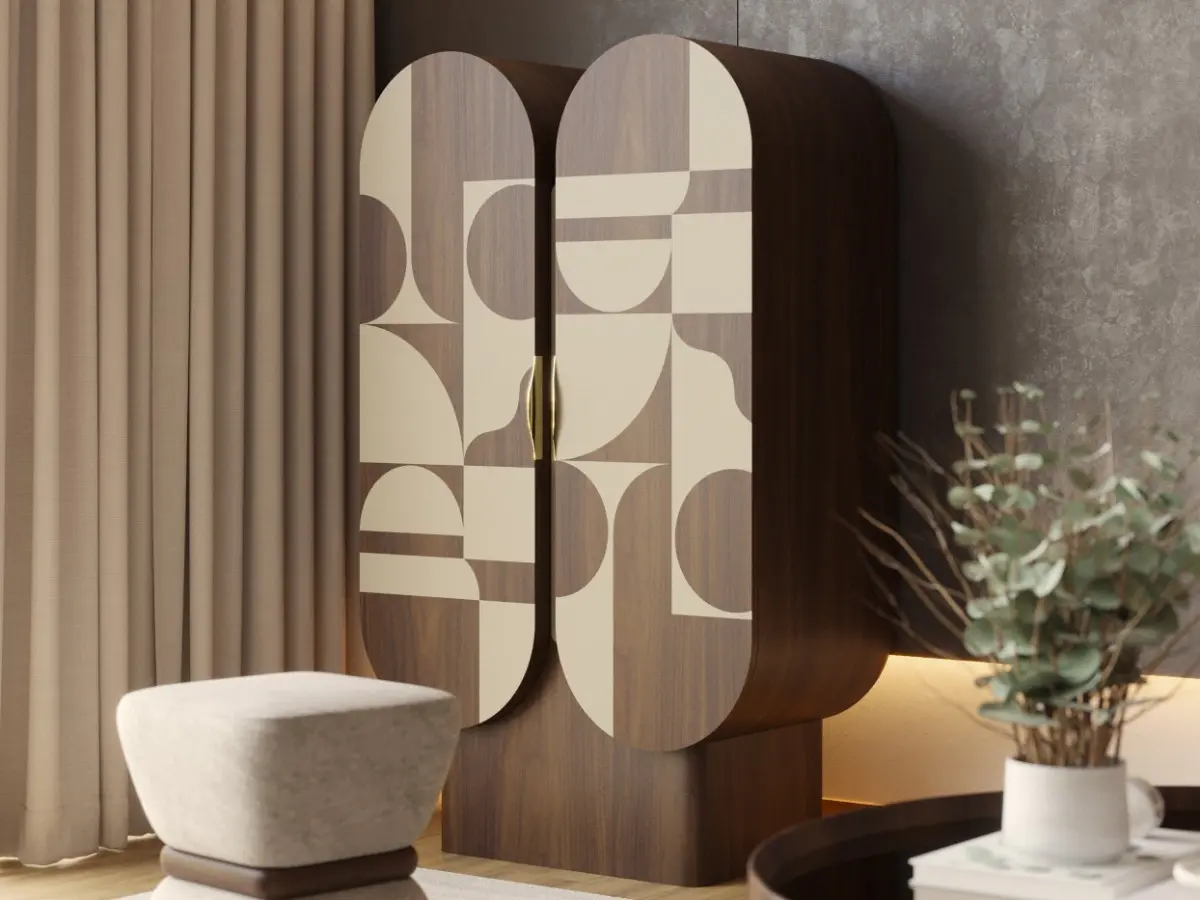 The Hays cabinet has two oval-shaped doors and is made of American walnut with a cream lacquer finish.