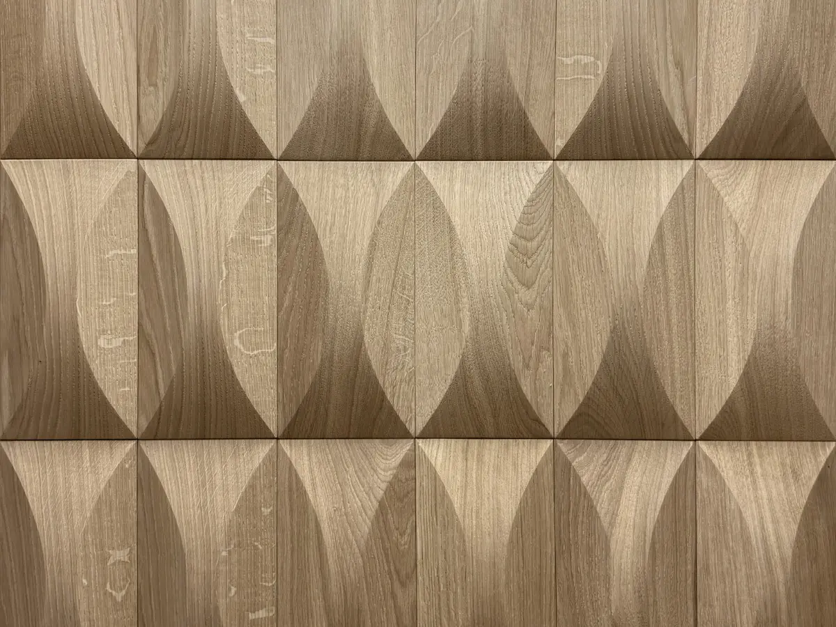 Sculptural 3D oak wood wall panels featuring the Luna leaf-inspired pattern, showcasing natural wood grain and organic texture.