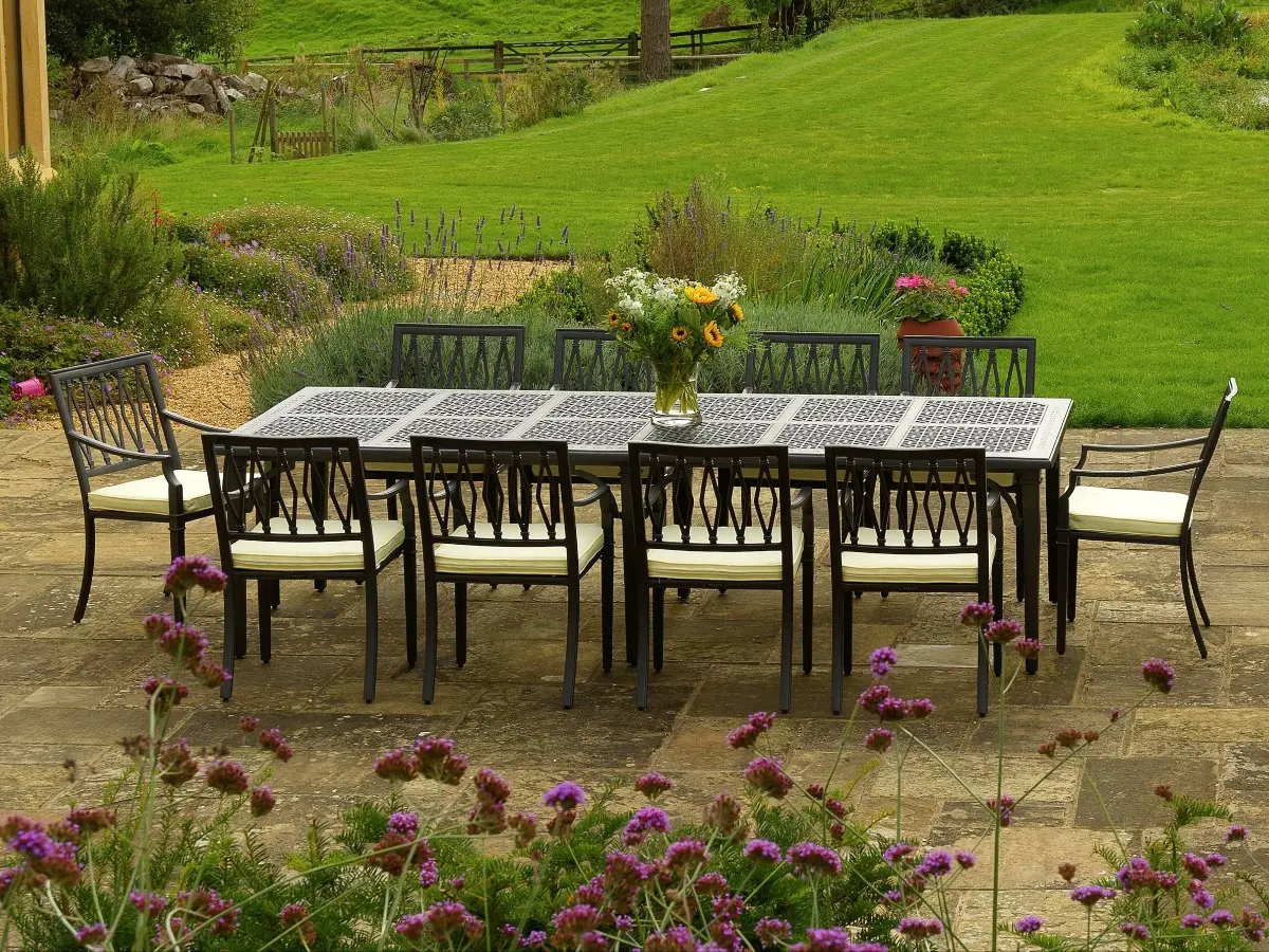 Aluminium table with 10 chairs on an outdoor patio