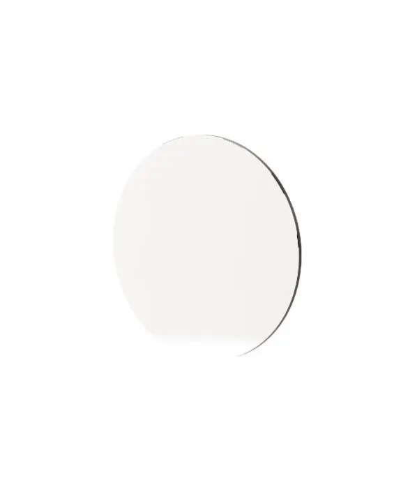 The Circle Mirror is shown against a white background as a perfectly round reflective disc with a smooth lacquered frame, its clean geometry and polished surface emphasizing a sense of balance, simplicity, and quiet elegance.