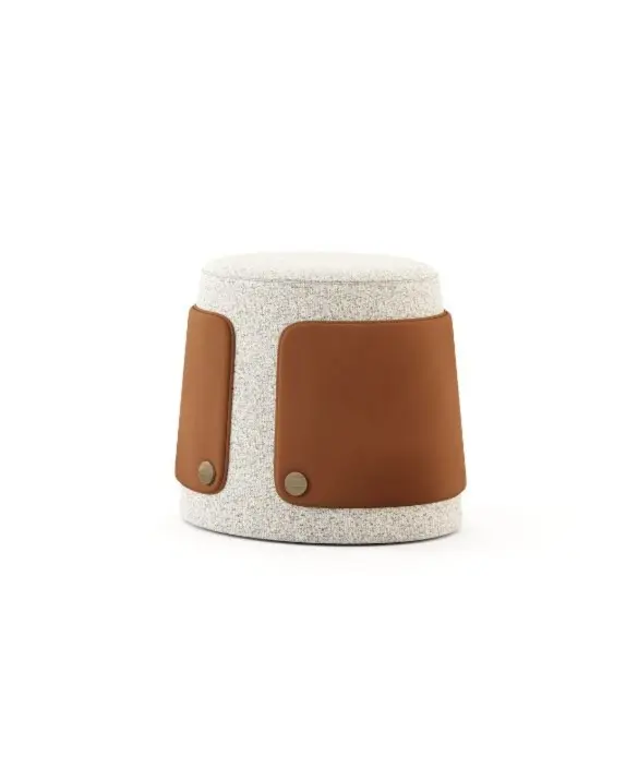 The Dolomites Stool is shown as a cylindrical piece with an organic, softly rounded form upholstered in textured light fabric, featuring smooth brown leather side panels secured with two round metallic fasteners near the base.