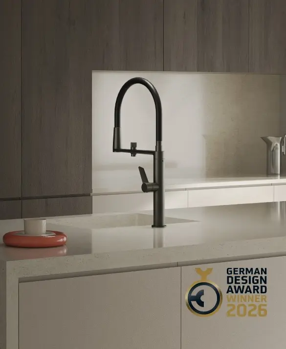 Pure Water kitchen tap by ramonsoler in graphite finish, featuring a built-in magnet system and designed for connection to water filtration systems. Awarded with the German Design Award 2026