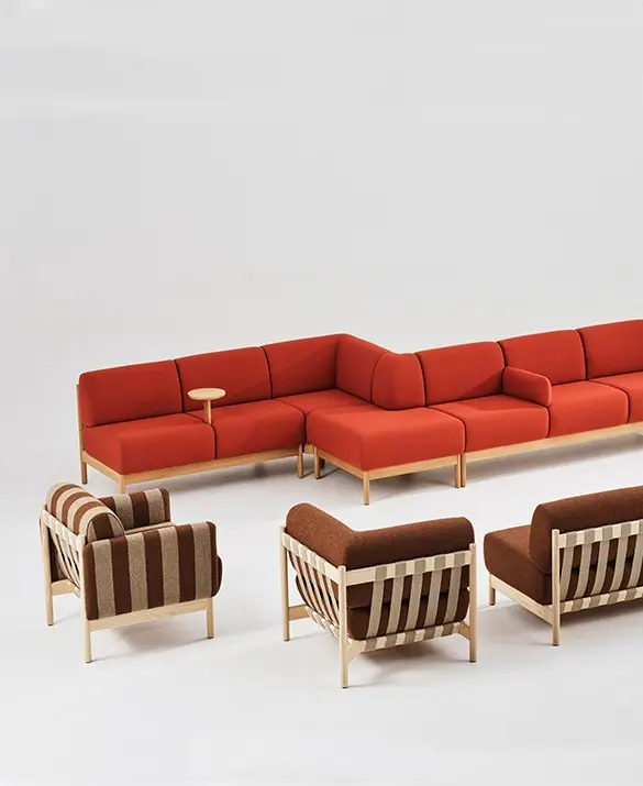 Soigne sofa armchair base in solid oak or ash. Upholstred in fabric or leather