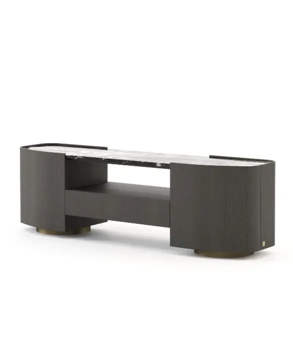 The Stone low console table is presented as a multimedia unit featuring a dark wood frame, rounded side compartments, a stone top and an open central shelf, supported by circular metal feet, in a contemporary interior setting.