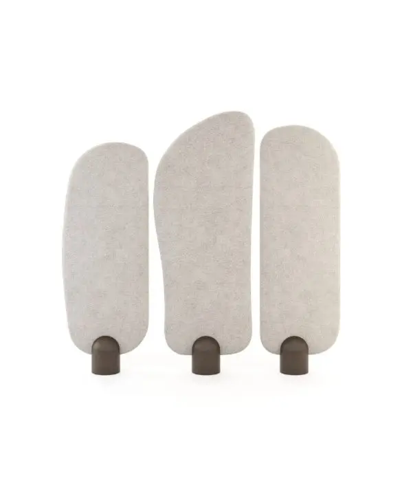 The Stone Screen is shown as three tall, fabric‑covered panels in light beige, each with a rounded top and supported by short dark bases, arranged side by side to highlight their varying heights and organic silhouettes.