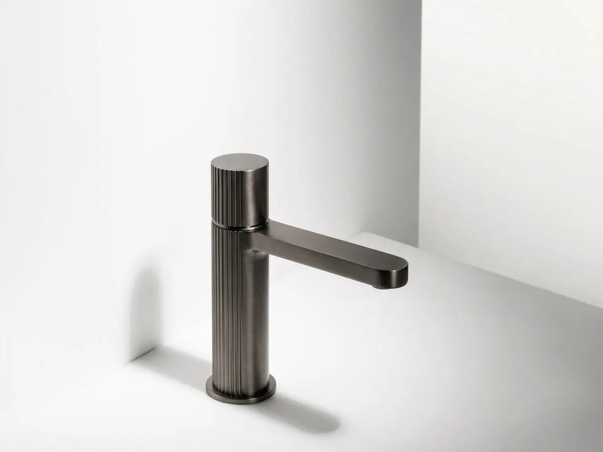 In the picture, Qtime - Single lever washbasin mixer in Matt Gun Metal PVD. Available also in 36 finishes.