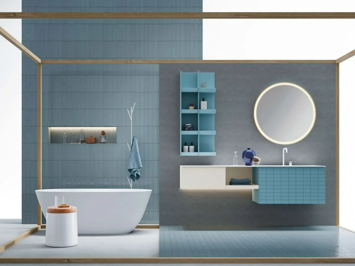 Bloom bathroom. Vanity unit with Tile door and Zig handle in matte turquoise lacquer, open base unit and side unit with smooth door in matte platinum lacquer. Washbasin top in matte white Teknorit. Round Bloom mirror with curved metal frame in matte white lacquer with perimeter LED lighting. Open wall unit in matte turquoise lacquer.