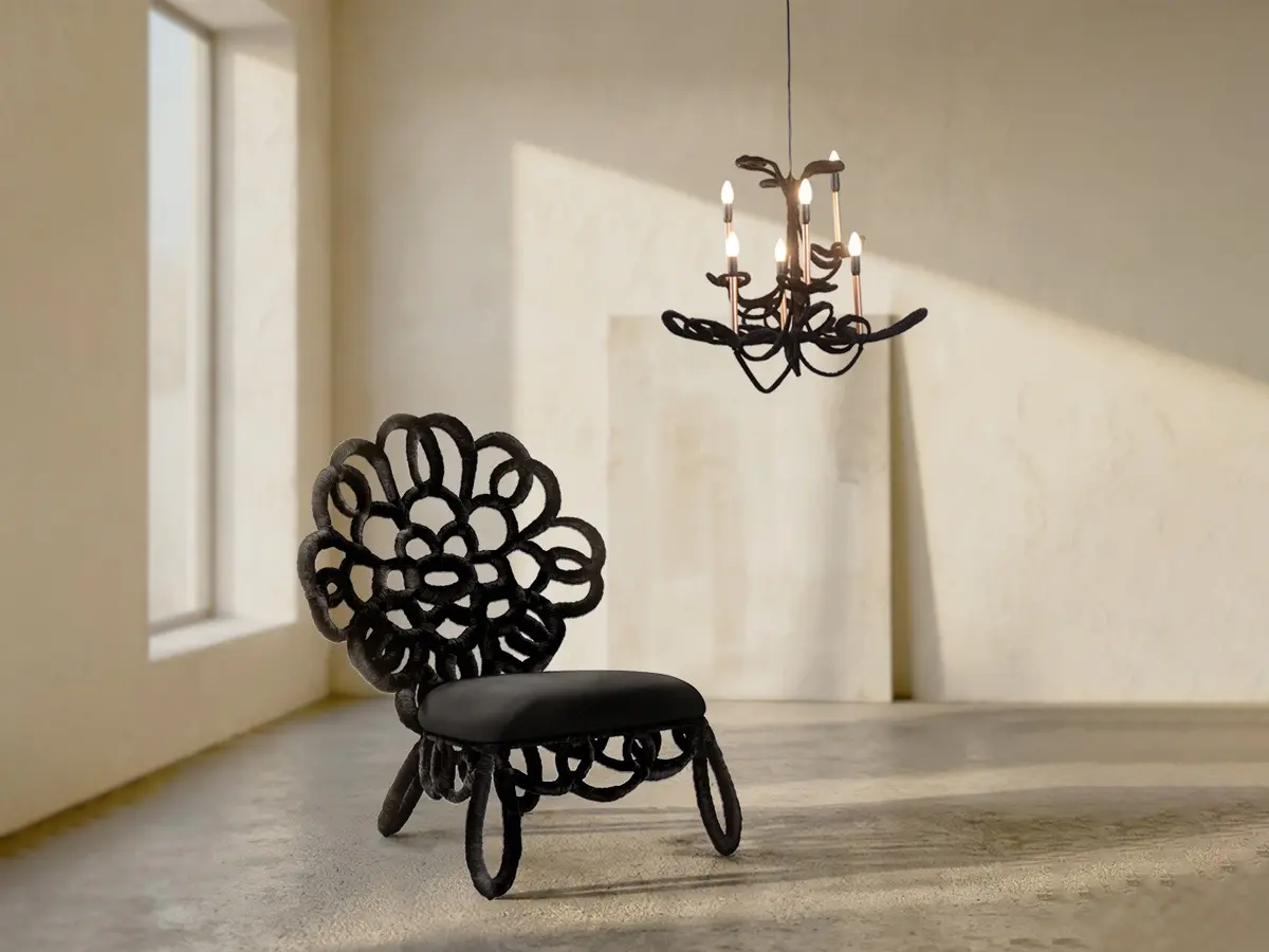 Spirited loops wrapped in dark, velvety strips create the distinct form of the SAMBA Side Chair's backseat. Above hangs the SAMBA Chandelier with playful loops supporting faux candles.