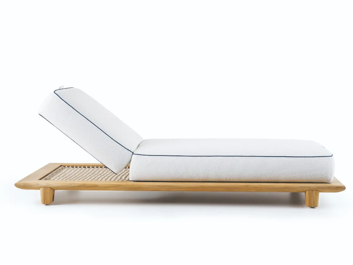 Reef sunbed with a natural teak frame and rope base.