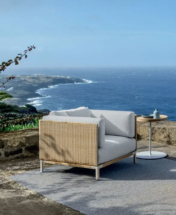 Baia Natural lounge armchair with a sea view
