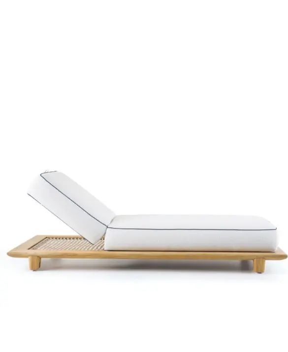 Reef sunbed with a natural teak frame and rope base.