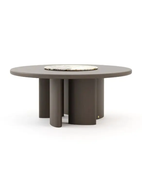 The Dolomites Round Dining Table is shown as a dark wooden round table with a smooth top and a light marble center inlay, supported by multiple cylindrical legs arranged in a circular formation, highlighting its sculptural and contemporary design.