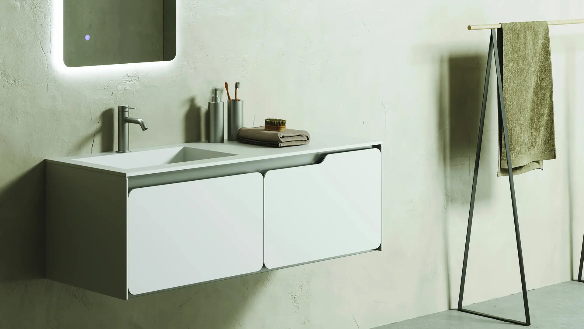 mobile rivestito in solid surface, rubinetto inox satinato con leve comando in tinta 