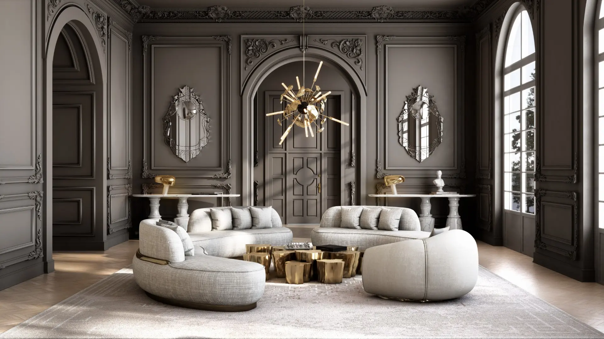 A luxurious contemporary living room by Boca do Lobo featuring the curved Odette Sofa and Soleil Armchair in neutral upholstery. At the center, the gold-leaf Eden Series center table sits beneath the sculptural Supernova Chandelier. The setting showcases dark grey walls with ornate classic moldings and large arched windows, blending modern furniture design with timeless luxury.