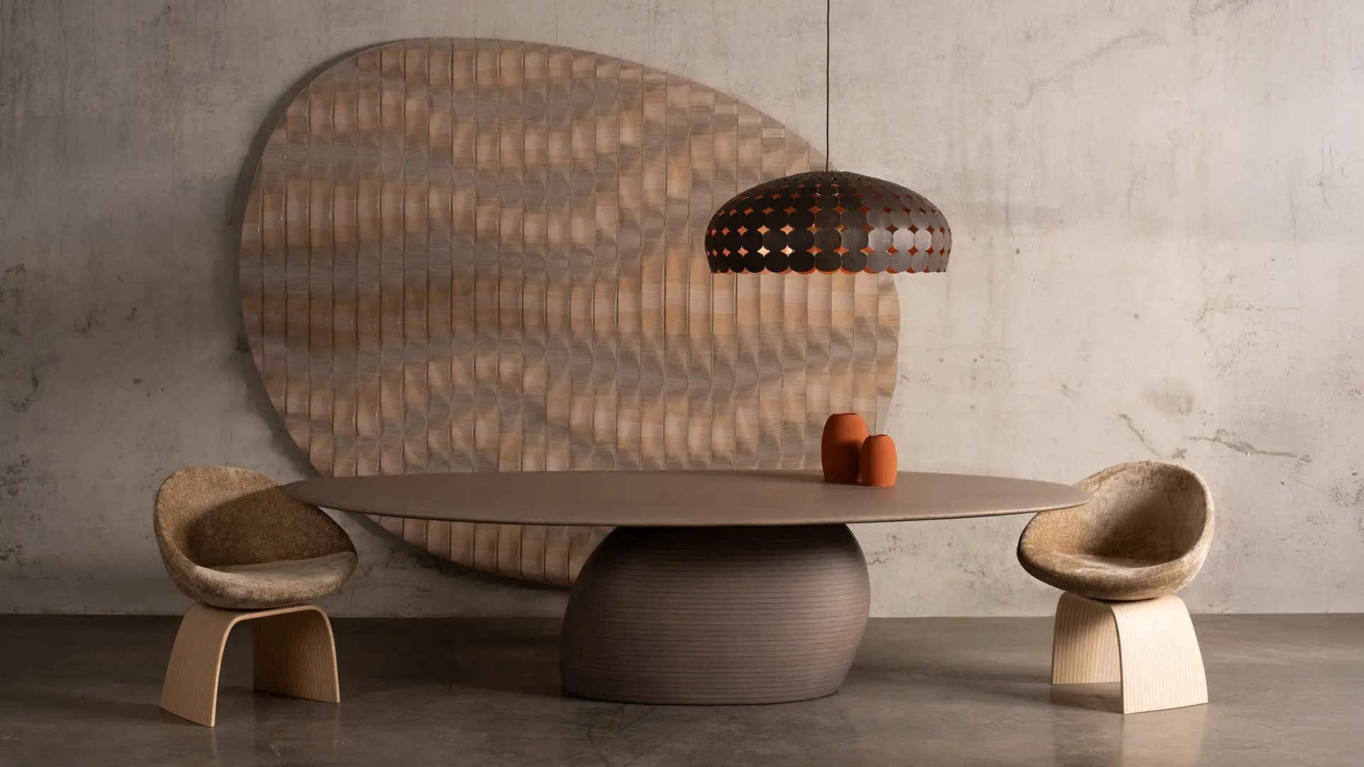 Toko table with two ovo dining chairs - iluminated with majo lamp and dunes art piece at the wall